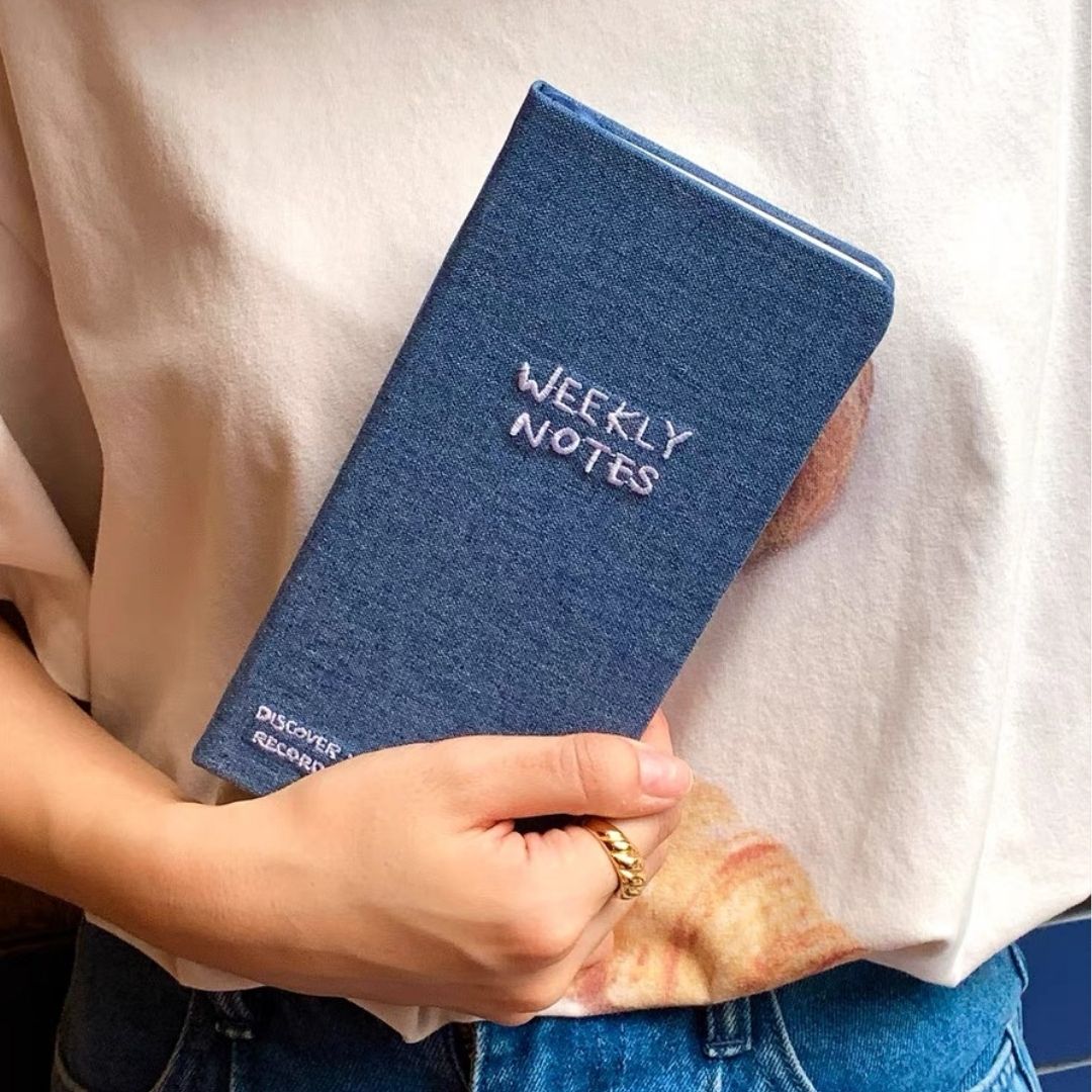 hand holding Denim Embroidery Day Planner - Paper Ground
